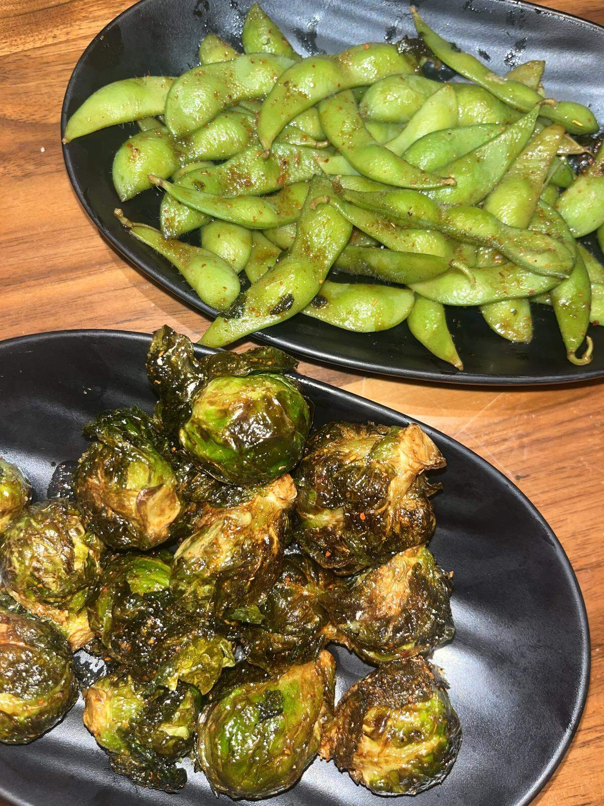 Edamame and fried brussel sprouts sprinkled with Tajin at Shōgun Taqueria in Fort Worth on Jan. 31, 2026.