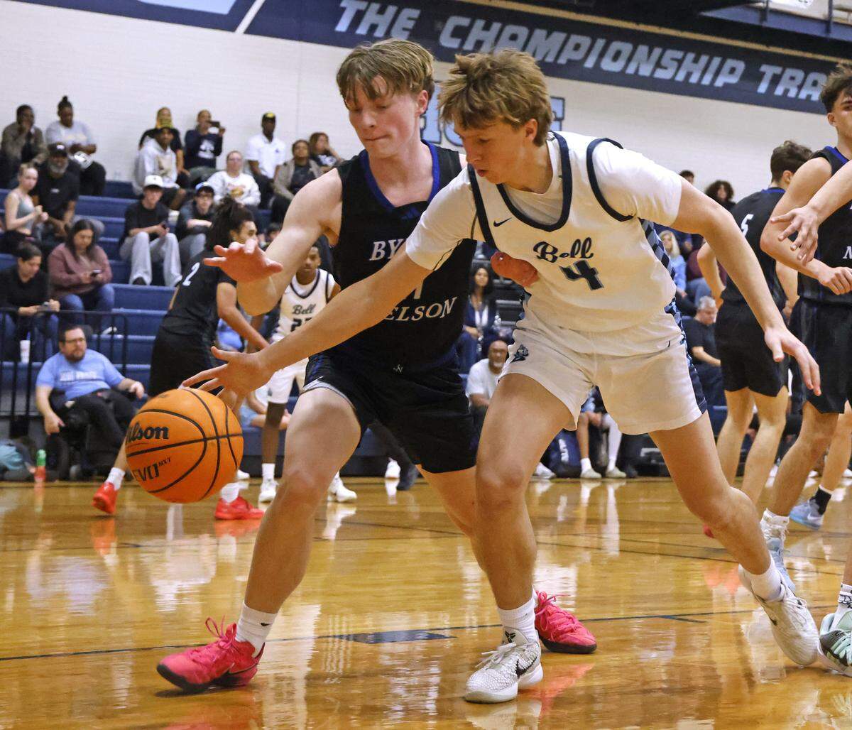 Byron Nelson guard Barrett Shinsky (11) and L.D. Bell forward Gavin Roberson (4) loose the ball out of bounds during the first half of a boys UIL basketball game between Byron Nelson and L.D. Bell at L.D. Bell High School in Hurst, Texas, Friday Feb. 06, 2026