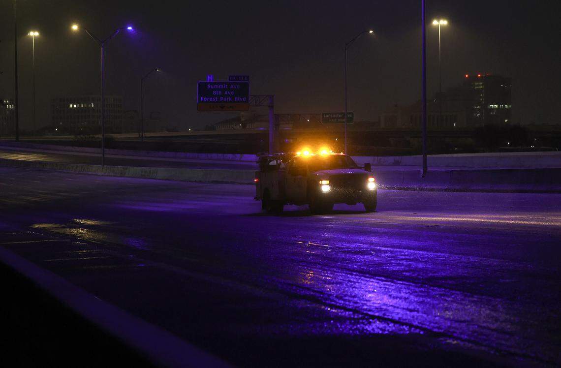 A wintry mix of precipitation covers Interstate 30 near downtown Fort Worth on Saturday morning, Jan. 24, 2026. A massive Arctic cold front is moving across North Texas, causing freezing temperatures.