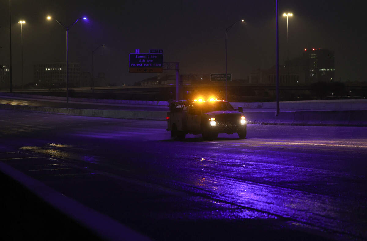 A wintry mix of precipitation covers Interstate 30 near downtown Fort Worth on Saturday morning, Jan. 24, 2026. A massive Arctic cold front is moving across North Texas, causing freezing temperatures.