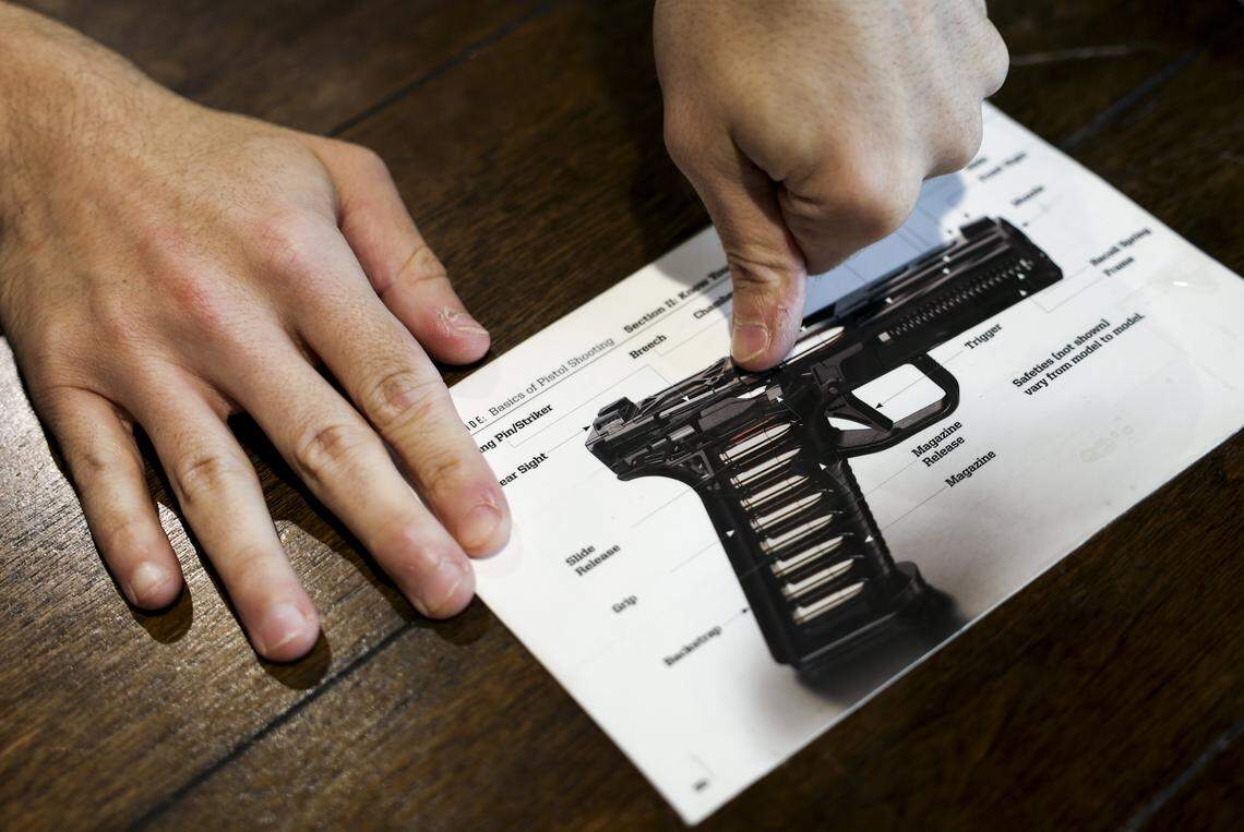 Ike Hajinazarian with Liberty for All Training Co. walks through the parts of a gun during a lesson on Tuesday, April 21, 2026 in The Colony, Texas. Liberty for All Training Co. is an inclusive firearm training company that offers shooting lessons and firearm safety courses.