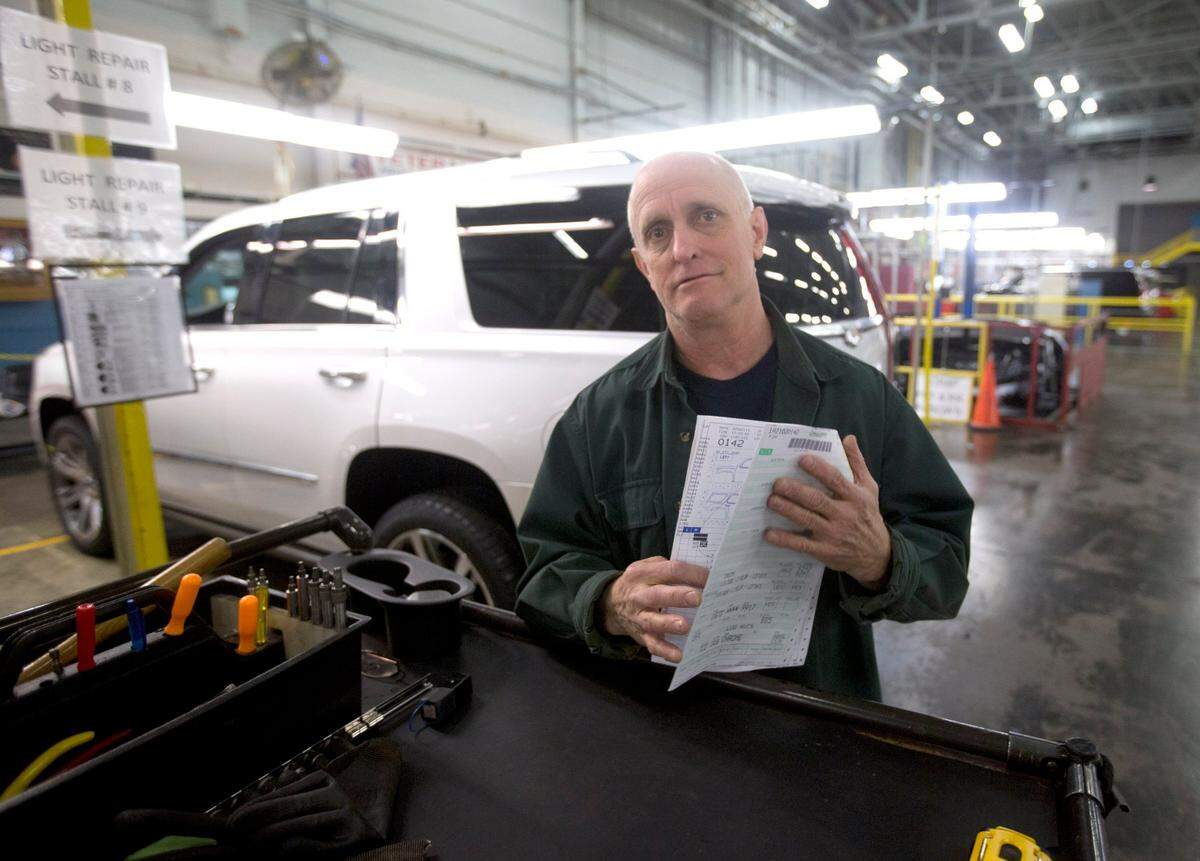Jan. 19, 2016: James “Bubba” Humes has been working for General Motors for 40 years. He is now doing light repairs on the large SUVs after they come off the line at the Arlington plant.