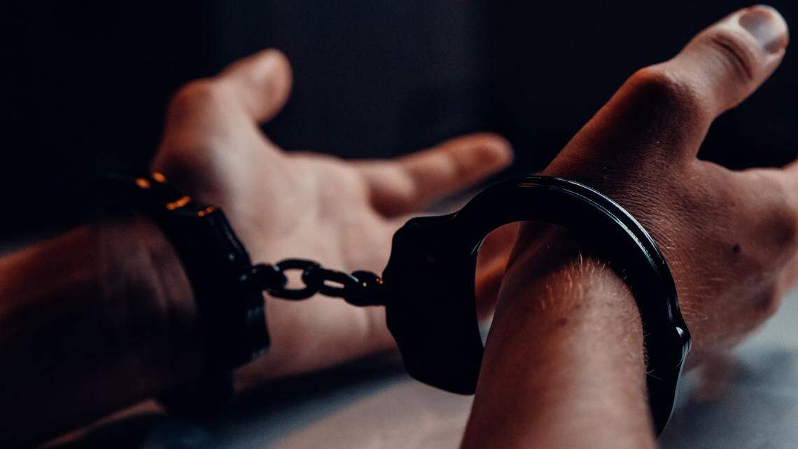 Photo illustration of handcuffs.