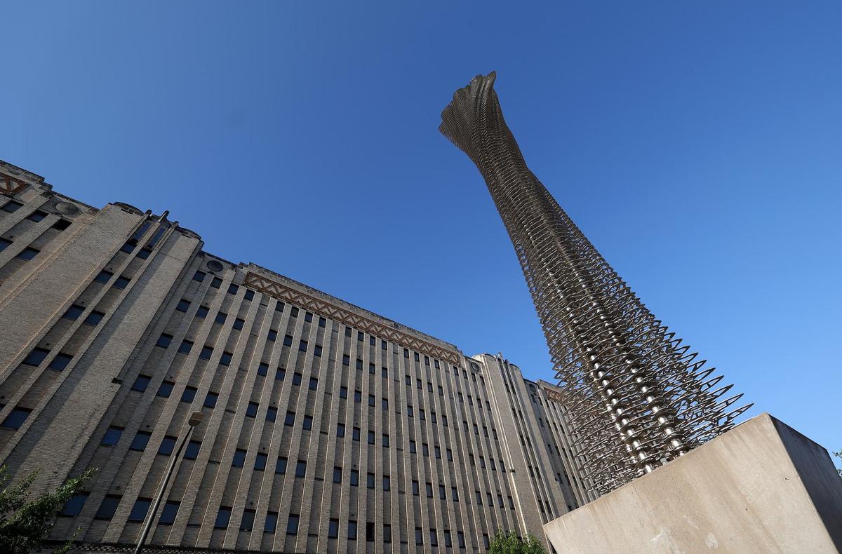 A metal sculpture pays tribute to the pylons that once elevated a section of I-30 that ran over West Lancaster Avenue until 2001. The art