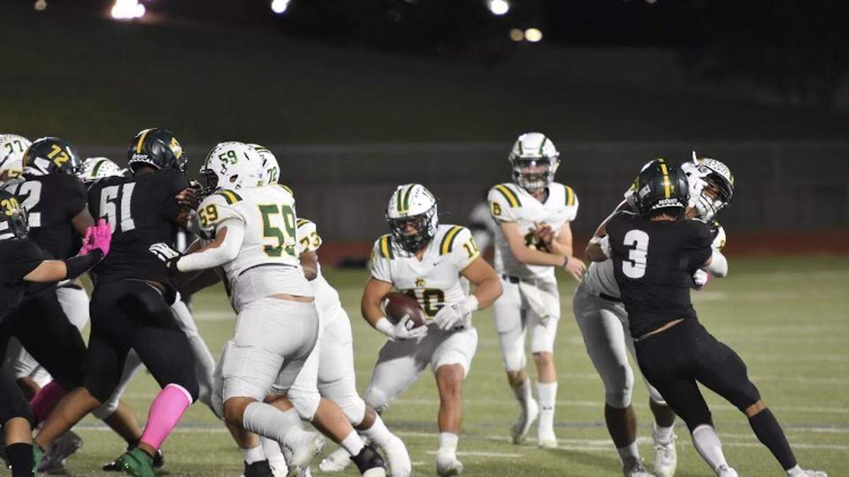 Benbrook’s Harry Gonzales (10) drives the Bobcats to their first touchdown of the night during a high school football game against Western Hills at Clark Stadium in Fort Worth, Texas, Friday Oct. 15, 2021 Benbrook won 43-13. (Jaylyn Ferguson/special to the Star-Telegram)
