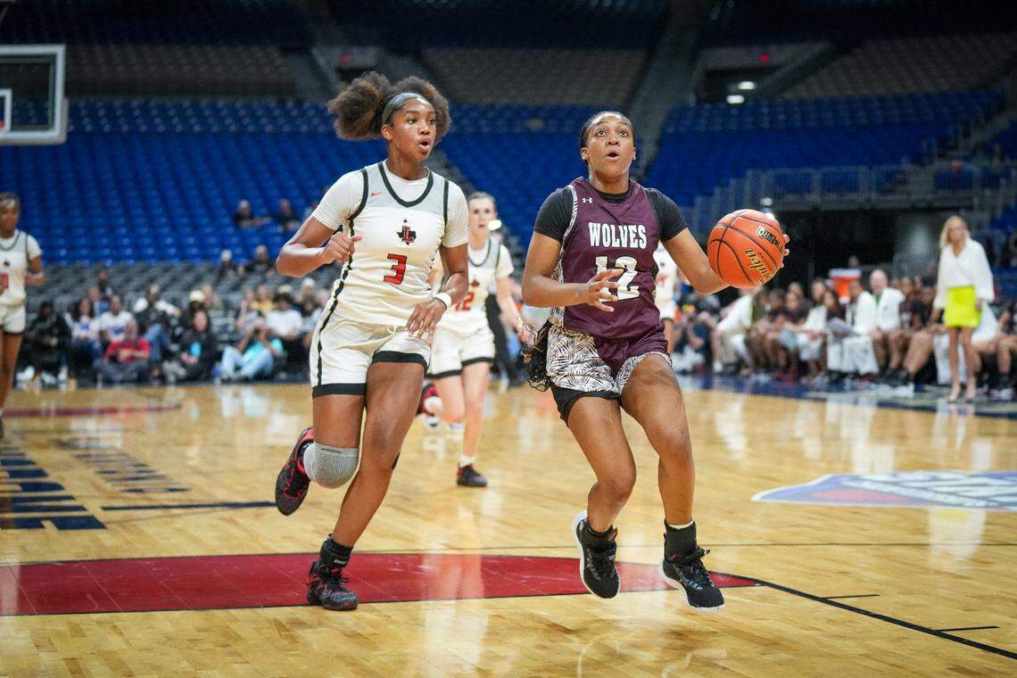 Mansfield Timberview’s Chrishawn Coleman looks for two as Frisco Liberty’s Jacy Abii looks for a blocked shot in the Class 5A state championship game on Saturday, March 2, 2024 at the Alamodome in San Antonio, Texas. Liberty defeated Timberview 60-51.