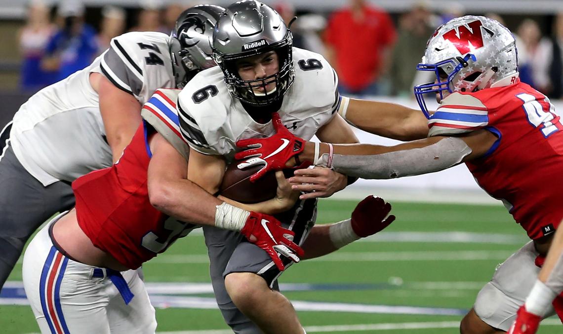 Denton Guyer quarterback Jackson Arnold (6) gets sacked against Austin Westlake during the second half of the 6A Division II High School State Football Championship game played at AT&T Stadium in Arlington, TX, Saturday, December 21, 2019.