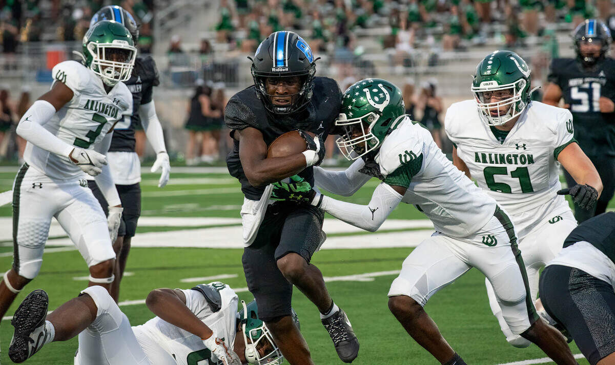 North Crowley running back Cornelius Warren III hits the hole against Arlington High on Friday September 1, 2023 at Crowley IDS Stadium in Fort Worth, Texas.
