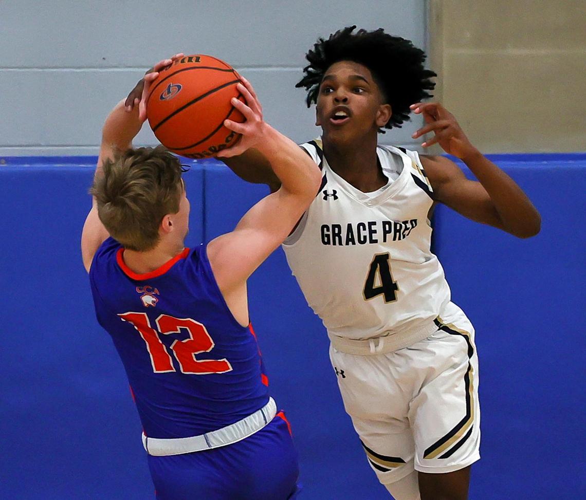 Colleyville Covenant guard Caleb Turner (12) tries to shoot over Arlington Grace Prep guard Josh Williams (4) during the first half of a TAPPS 4A Regional Round Boys Basketball playoff game played on March 6, 2021 at Brewer High School in Fort Worth TX. (Steve Nurenberg Special to the Star-Telegram)