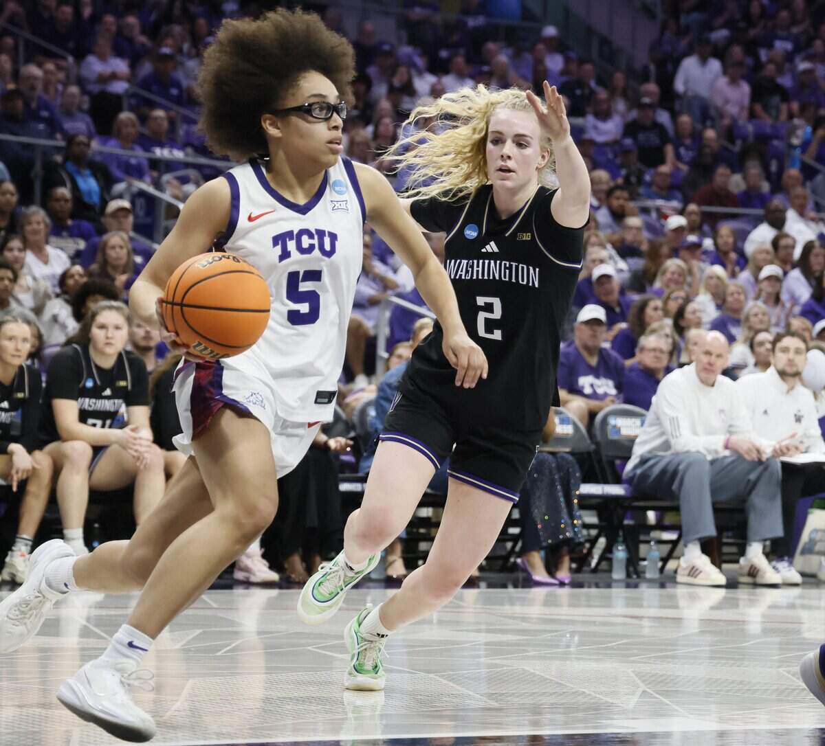 Washington guard Avery Howell (2) chases TCU guard Olivia Miles (5) into the paint during the first half of a second round NCAA Division I Women's Basketball Championship game at Schollmeier Arena in Fort Worth, Texas, Sunday, March, 22, 2026.