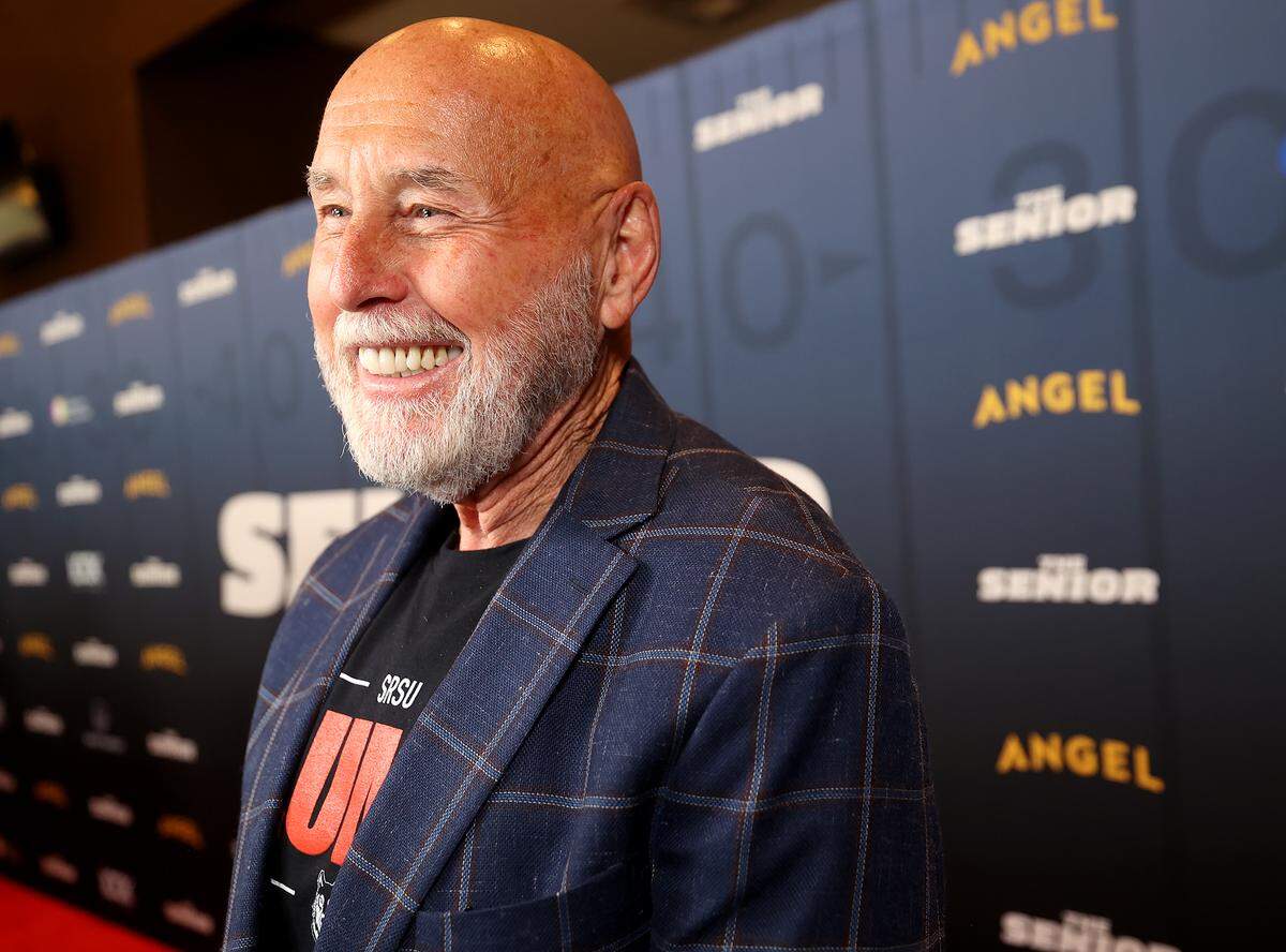 Mike Flynt walks the red carpet during the premiere of “The Senior” held on Monday, Sept. 8, 2025, at LOOK Dine-In Cinemas in Bedford. The movie is based on Flynt’s life and decision to return to Sul Ross State University to play football in his fifties.