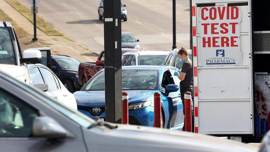 Sarah Brown administers COVID-19 tests at a site run by Grand Avenue Pharmacy at the intersection of Hemphill and Berry Streets on Monday, December 27, 2021. The site is open from 9 a.m. to 7 p.m. every day of the week.