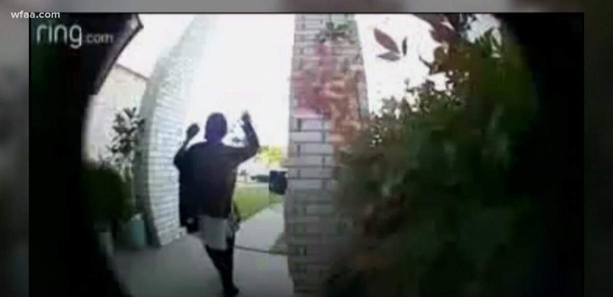 An Arlington family's home surveillance camera captures the moment police arrive with guns drawn ordering them out of the house.