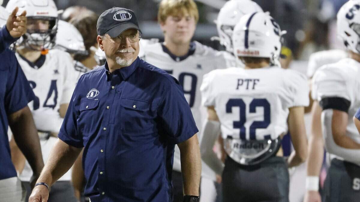 Fort Worth All Saints head coach Aaron Beck roams the sidelines during the first half against Fort Worth Christian on Friday at Barrow Field in North Richland Hills.