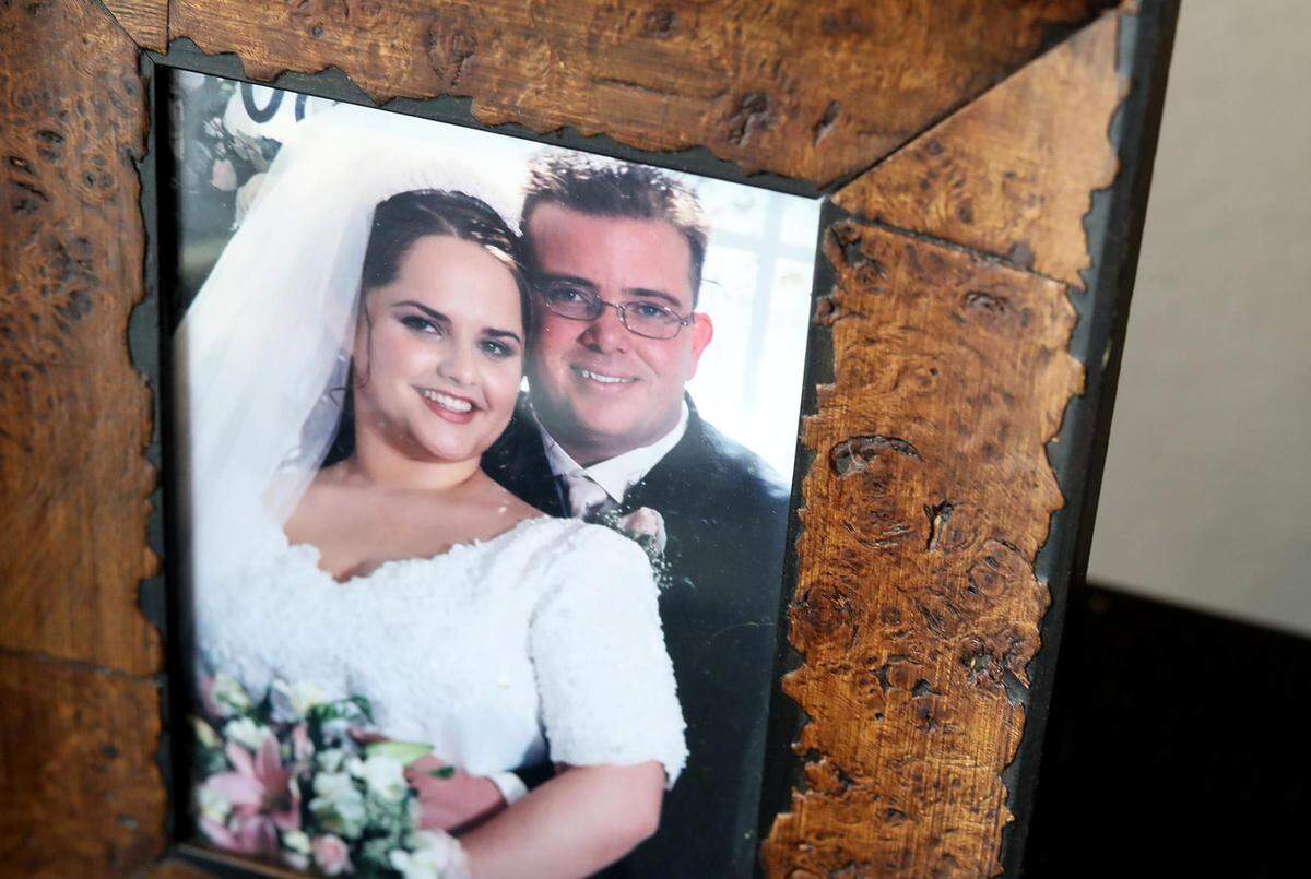 A photograph on a side table shows Jane and Aaron Watson on their wedding day.