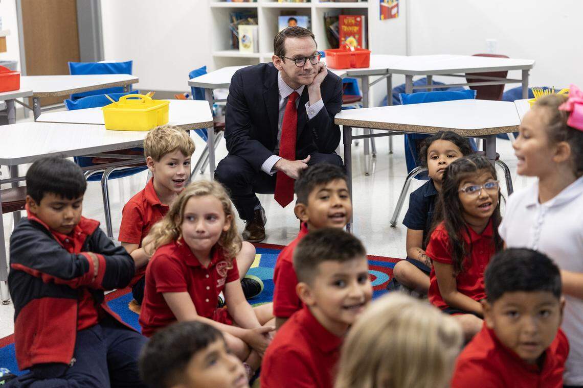 Mike Morath, the Texas Education Commissioner, tours through a classroom following a press conference regarding the updated A through F scores of Dallas and Fort Worth schools at Walnut Hill International Leadership Academy in Dallas on Friday, Aug. 15, 2025.