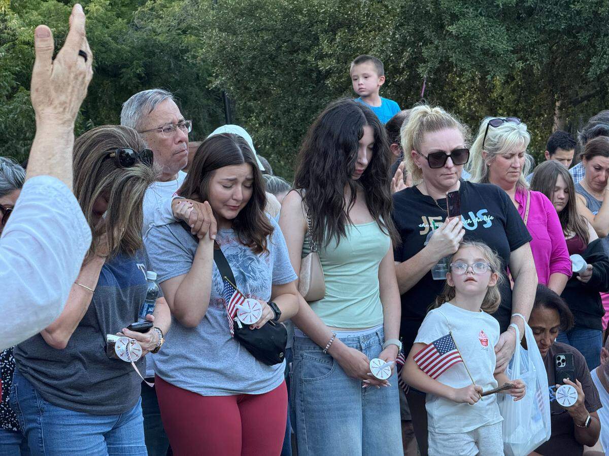 About 1,000 North Texans prayed at a vigil for Charlie Kirk on Sunday night, Sept. 14, at Trinity Park in Fort Worth.
