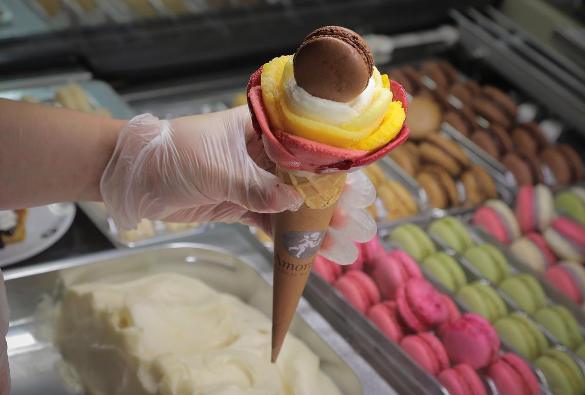 Taylor Daniel makes a rose out of gelato at Amorino Gelato in the Shops at Clearfork in Fort Worth