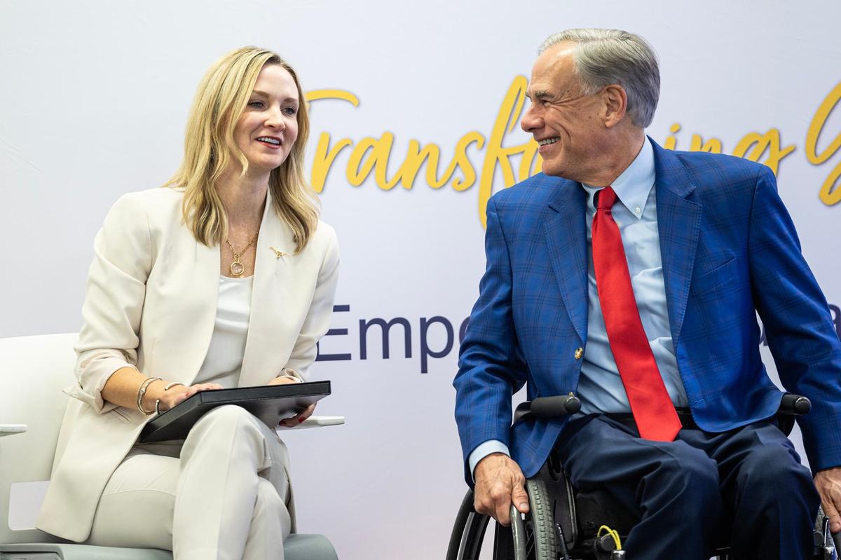 Fort Worth Mayor Mattie Parker, left, and Texas State Governor Greg Abbott share a laugh on stage for the grand opening ceremony of the New Heights Adult High School at the Tarrant County College Opportunity Campus in Fort Worth on Wednesday, Sept. 25, 2024. New Heights is the first dual enrollment adult high school in Texas.