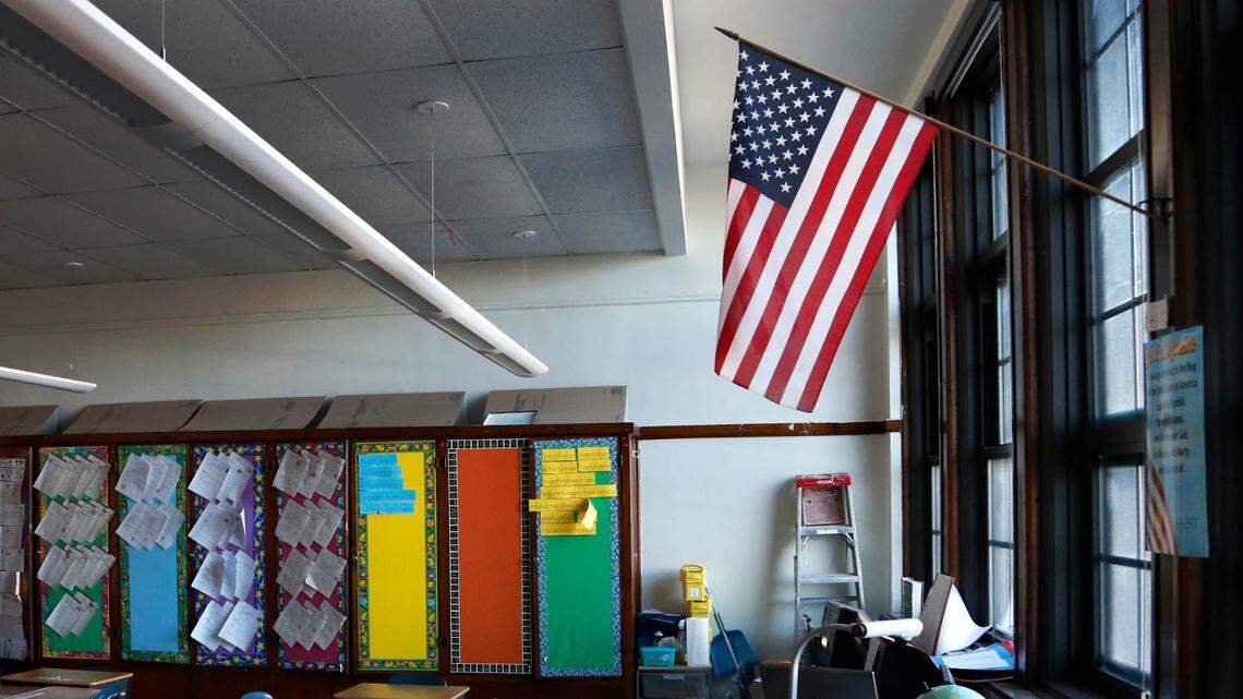 File photo of an American flag hanging in a classroom. A Texas student was recently awarded a $90,000 settlement after she says she was harassed for not reciting the Pledge of Allegiance at school.