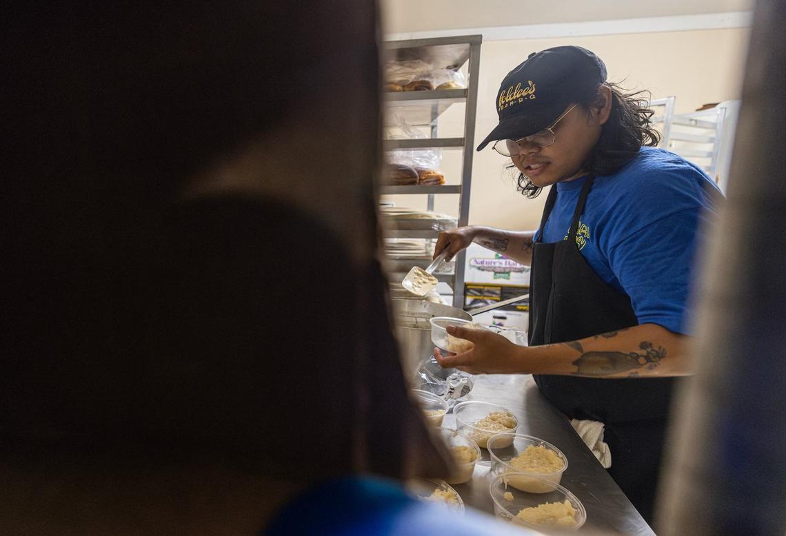 Nupohn Inthanousay, one of the five owners of Goldee’s Barbecue, portions sticky rice for the mango sticky rice dessert for service prior to opening at its location in Fort Worth on Friday, June 28, 2024.