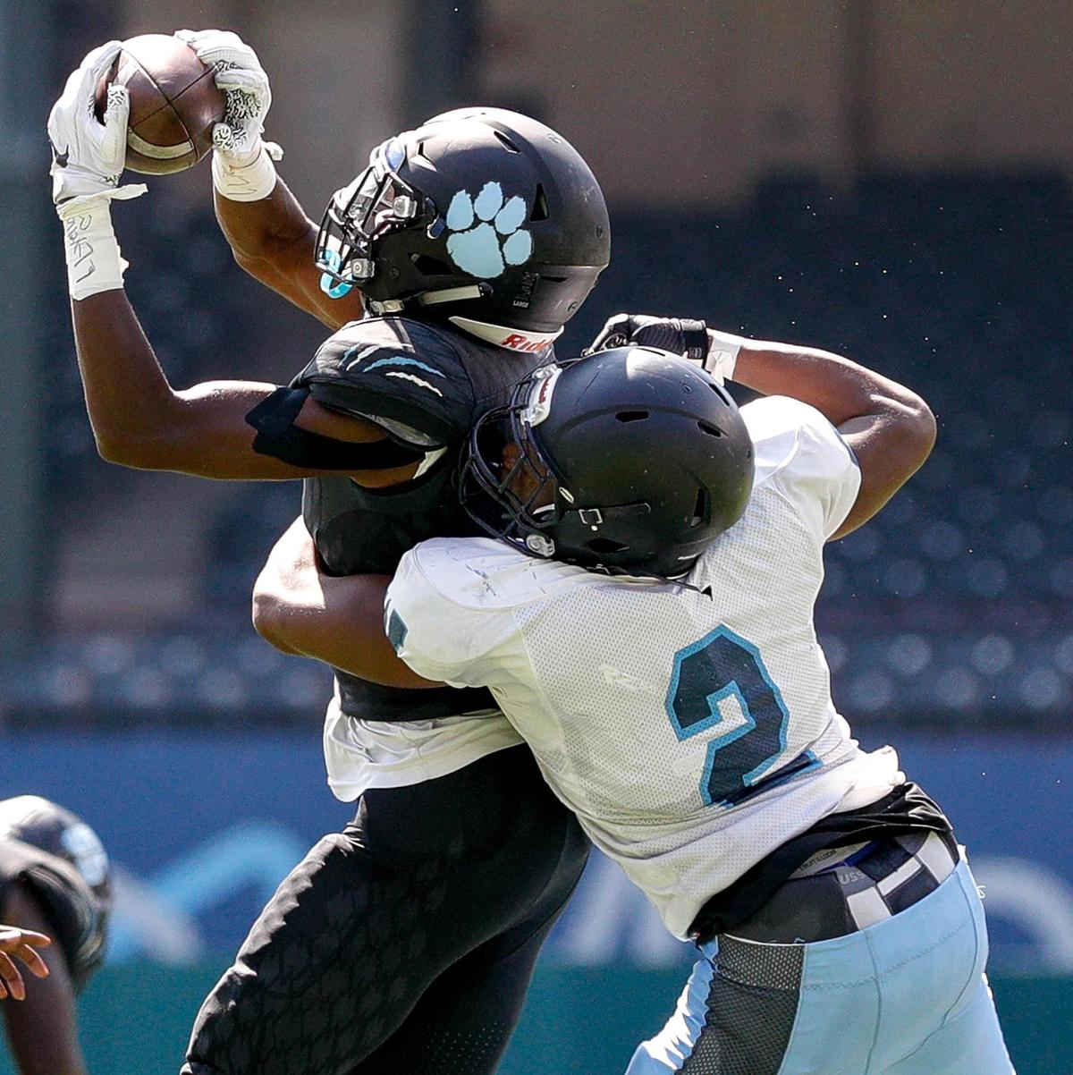 Arlington Seguin receiver X’avion Brice (5) comes up with a reception against O.D. Wyatt cornerback Robert Wilson during the first half, Saturday afternoon, Sepember 26, 2020 played at Globe Life Park in Arlington, TX (Steve Nurenberg Special to the Star-Telegram)