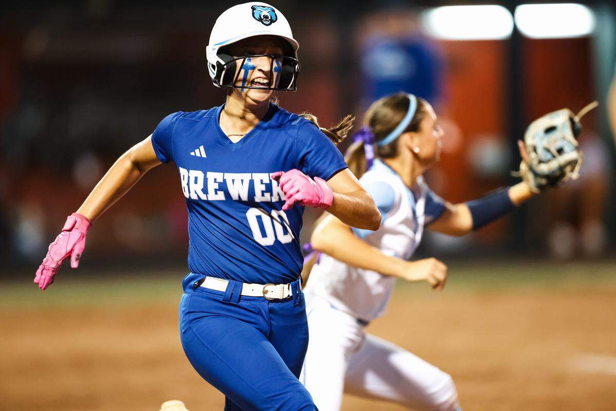 White Settlement Brewer center fielder Ava Pena (00) runs as she beat out a throw to first base against Montgomery Lake Creek in the UIL Class 5A Division II state softball championship game at Red & Charline McCombs field in Austin, Texas, on Friday, May 29, 2026.