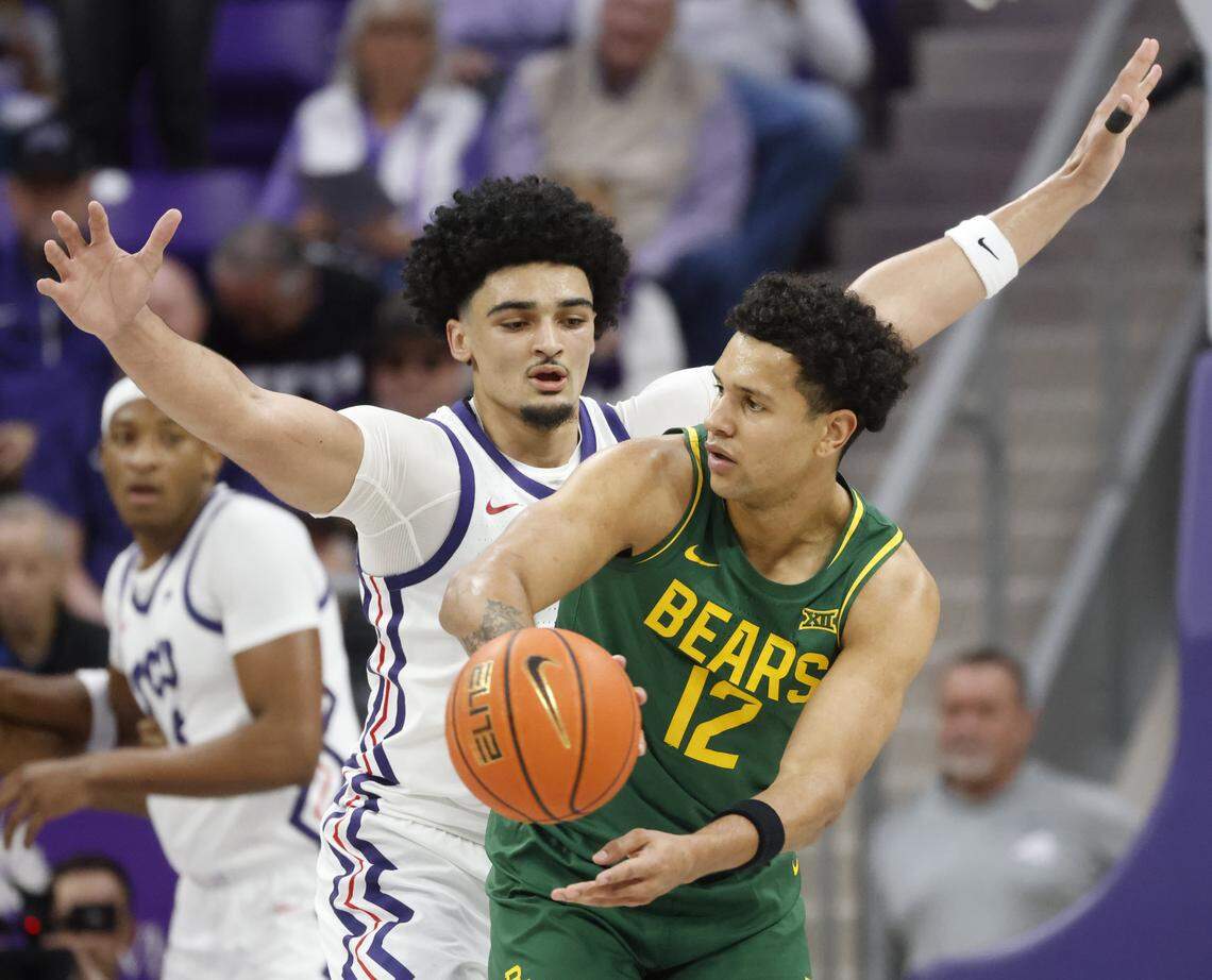 Baylor guard Michael Rataj (12) passes the ball away from TCU forward David Punch (15) during the first half of a NCAA basketball game between Baylor University and TCU at Schollmaier Arena in Fort Worth, Texas, Saturday Jan. 03, 2026