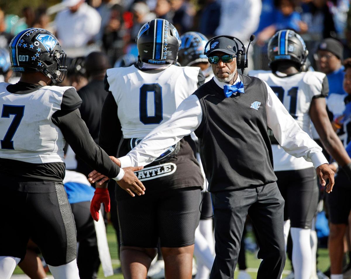 North Crowley defensive coordinator Rodney Ingram congratulates players leaving the field during the first half of a UIL Conference 6A Division 1 quarterfinal football playoff game at Dragon Stadium in Southlake, Texas, Saturday, Dec. 02, 2023.