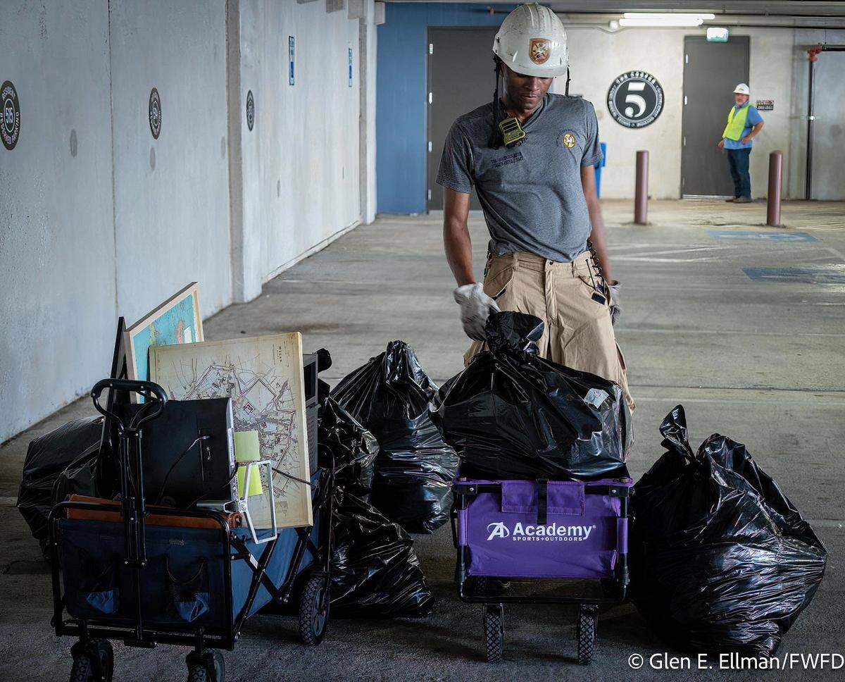 Fort Worth firefighters helped collect personal items on Monday, June 30, for residents displaced by the June 23 fire at The Cooper apartments on West Rosedale Street.