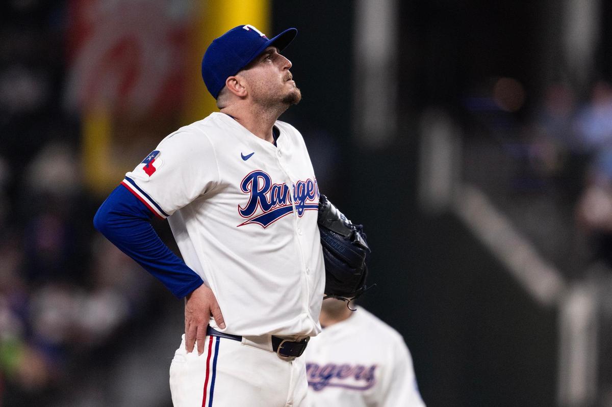 Rangers closing pitcher Luke Jackson (77) reacts to giving up a three-run home run to Red Sox outfielder Wilyer Abreu (52) in the top of the ninth inning in the MLB Opening Day game between the Rangers and Red Sox at Globe Life Field in Arlington on Thursday, March 27, 2025.