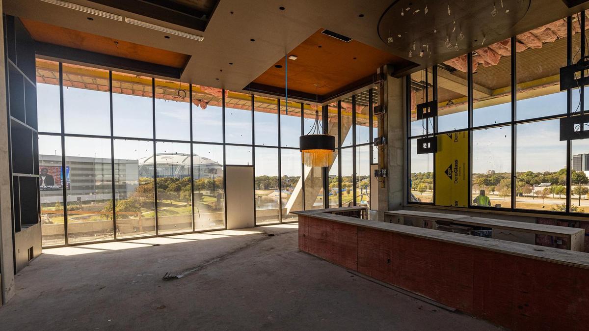 The inside of the resident bar and lounge with views of AT&T Stadium at the One Rangers Way residential apartment complex in the Arlington Entertainment District on Tuesday, Nov. 12, 2024.