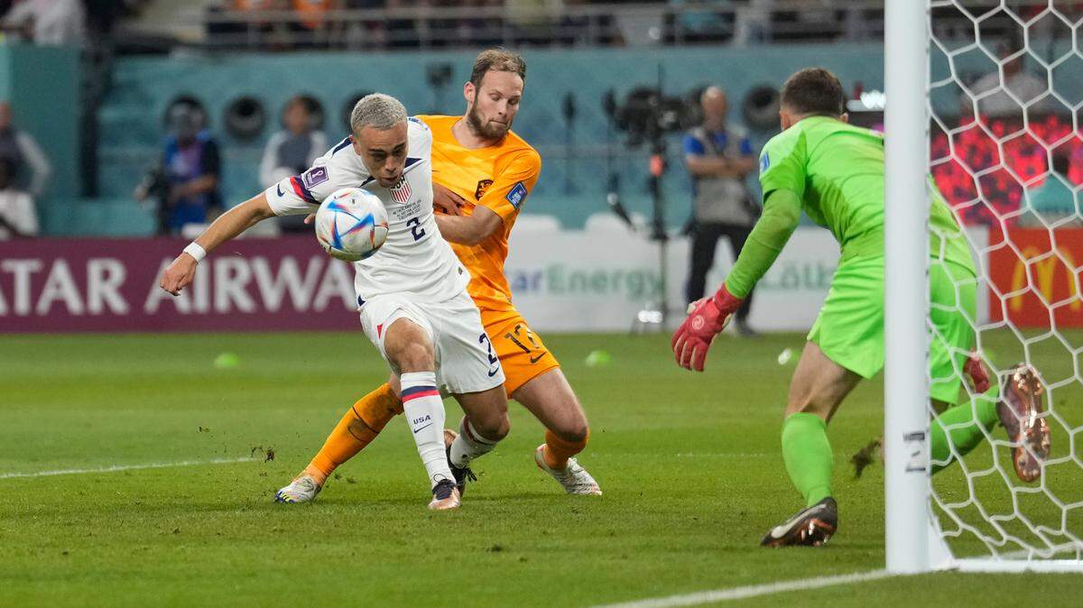 Sergino Dest of the United States and Daley Blind of the Netherlands fight for the ball during the World Cup round of 16 soccer match between the Netherlands and the United States, at the Khalifa International Stadium in Doha, Qatar, Saturday, Dec. 3, 2022. (AP Photo/Ashley Landis)on Saturday.