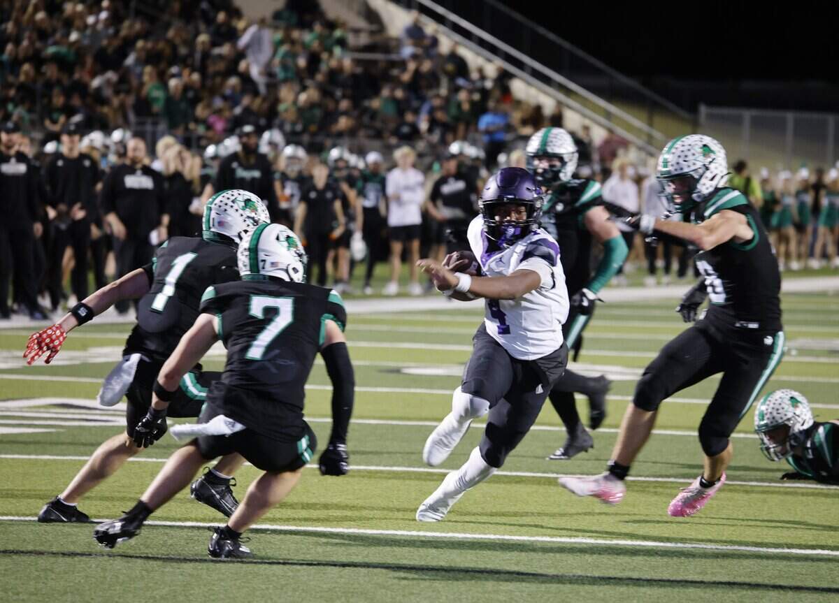 Crowley quarterback Antwain Griffin (4) got to the goal line for Crowley's only trip into the end zone but was negated by a penalty during the first half of a UIL Conference 6A D2 Bi-District playoff game at Dragon Stadium in Southlake, Texas, Thursday, Nov. 13, 2025.