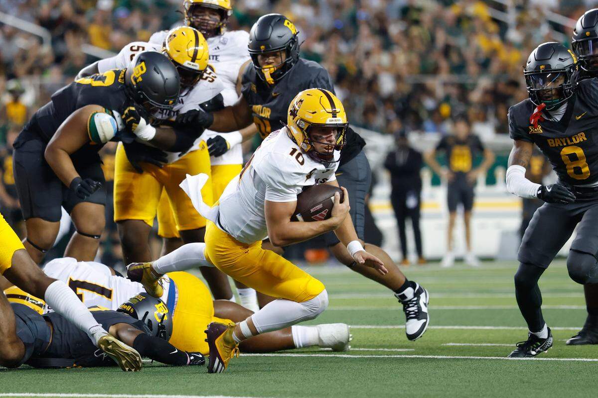 Sep 20, 2025; Waco, Texas, USA; Arizona State Sun Devils quarterback Sam Leavitt (10) carries the ball for a short gain against the Baylor Bears during the first half at McLane Stadium. Mandatory Credit: Chris Jones-Imagn Images