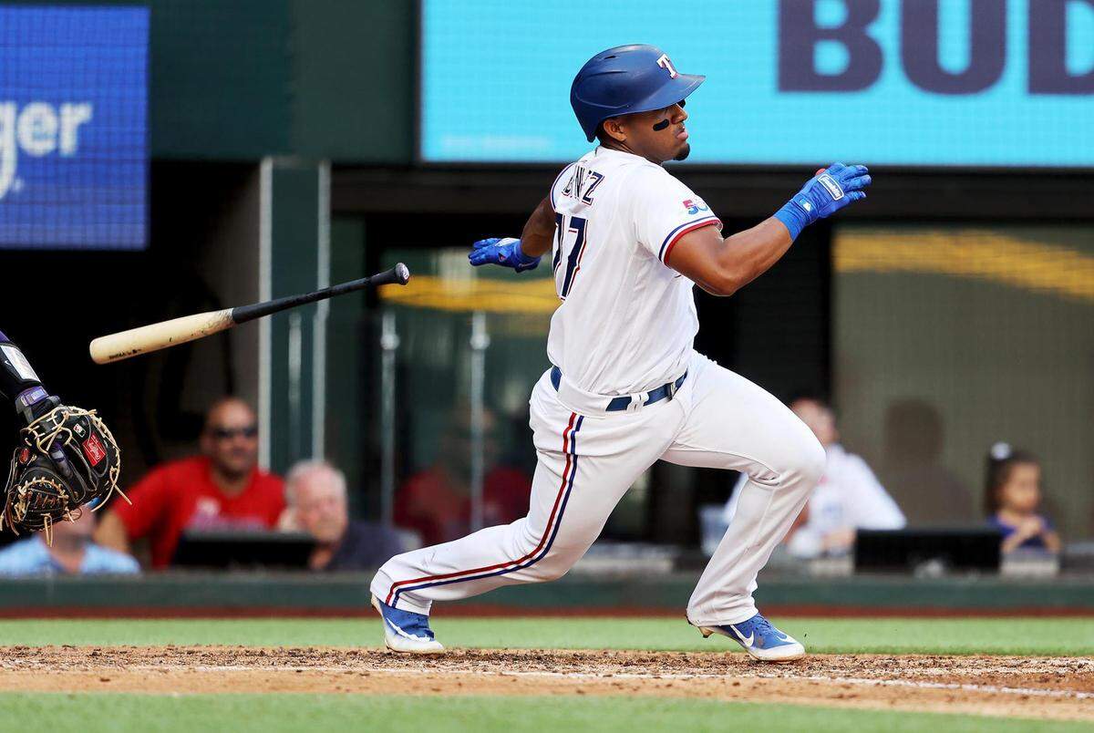Texas Rangers designated hitter Andy Ibáñez makes contact for a single against the Colorado Rockies on Monday, April 11, 2022, at Globe Life Field.