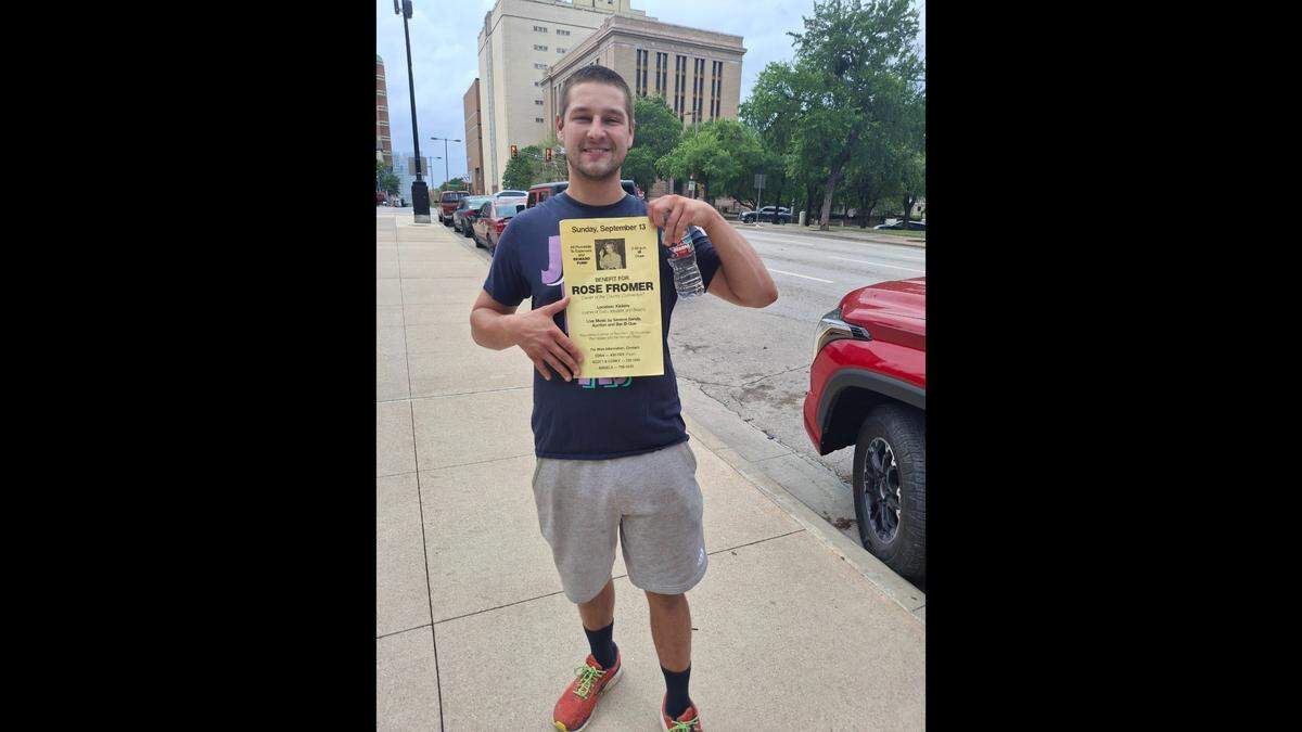 Jonah Krause carried a flyer with a photo of his grandmother, Rose Fromer, during the third annual Thaw The Cold Cases awareness walk in downtown Fort Worth on April 19. Fromer was murdered in 1992.
