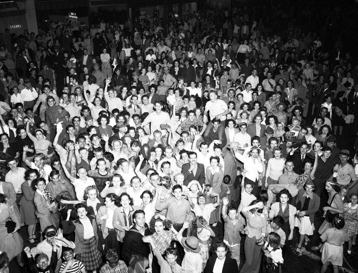 A crowd of Halloween revelers in 1945.
