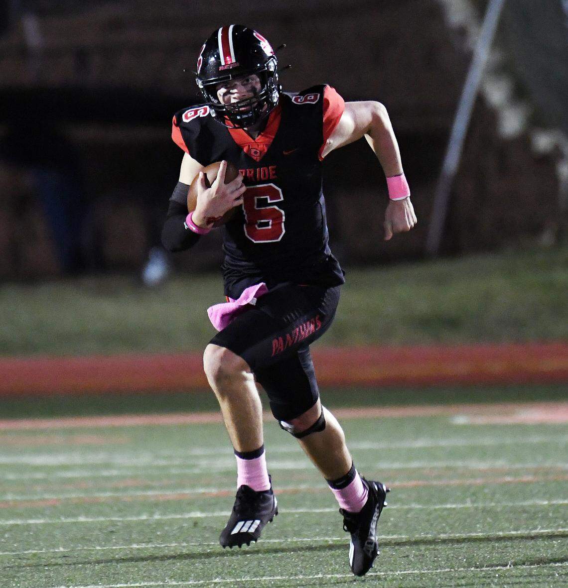 Colleyville Heritage quarterback Weston Smith scrambles out of the backfield against Mansfield Summit in the second quarter of their district 4-5A Division 1 football game Friday, October 15, 2021 at Mustang-Panther Stadium in Grapevine, Texas. Special/Bob Haynes