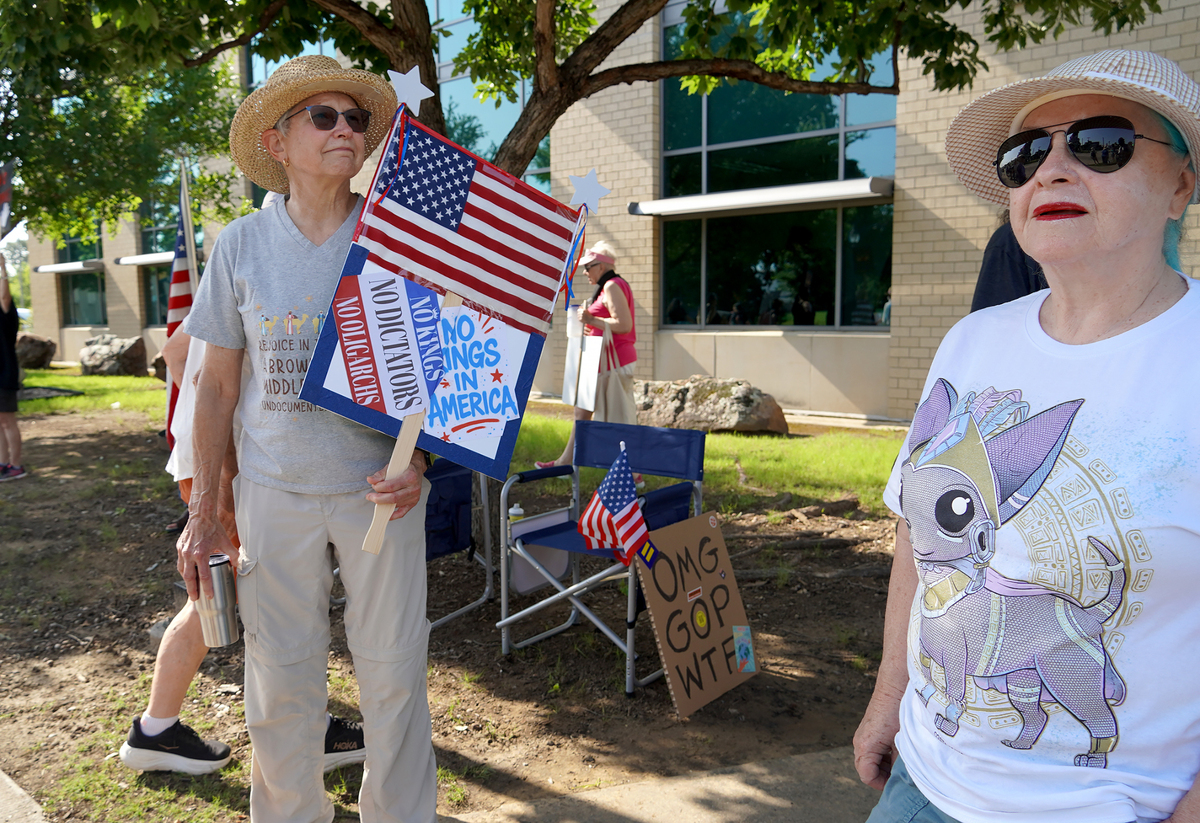 Protesters gather for the “No Kings Day” protest on June 14, 2025 in Arlington.