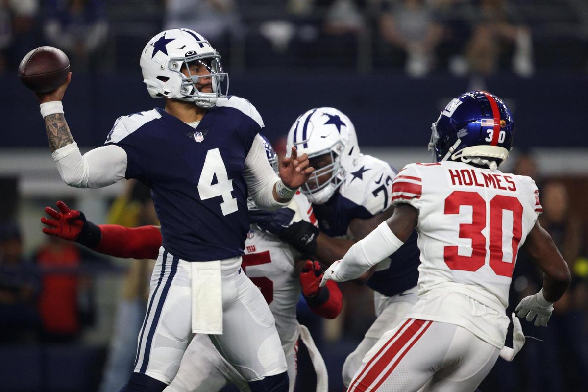 Cowboys linebacker Leighton Vander Esch brings down Giants tight end Lawrence Cager during their game at the AT&T Stadium in Arlington on Thursday, Nov. 24, 2022.
