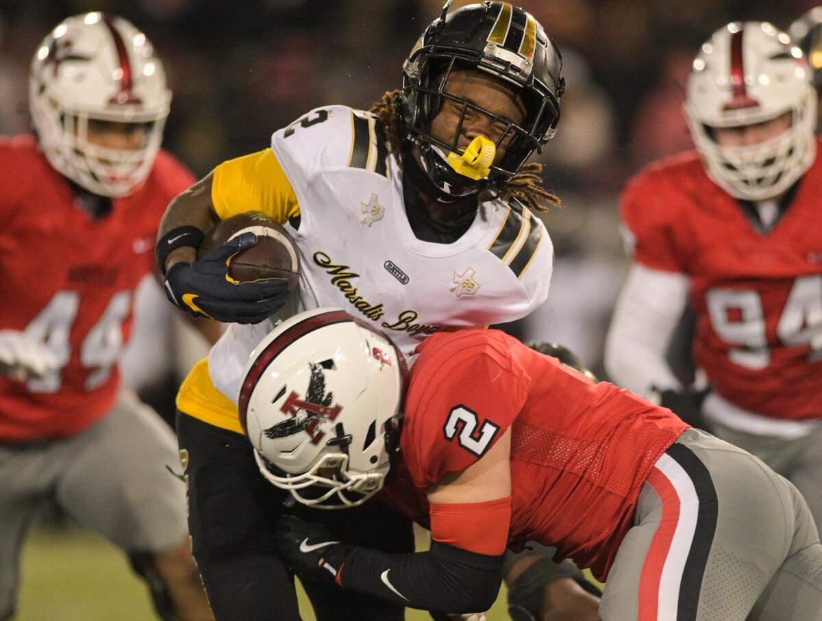 South Oak Cliff running back Mikail Trotter (2) reacts to being hit by Argyle defensive back Garrett Westrom (2) in a Class 5A Division II state semifinal on Friday, Dec. 13, 2024 at Gerald J. Ford Stadium in University Park, Texas.