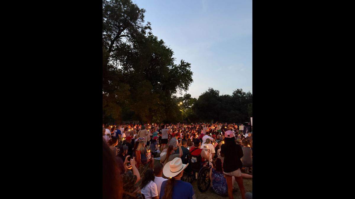 About 1,000 North Texans prayed at a vigil for conservative activist Charlie Kirk on Sunday night, Sept. 14, at Trinity Park in Fort Worth.