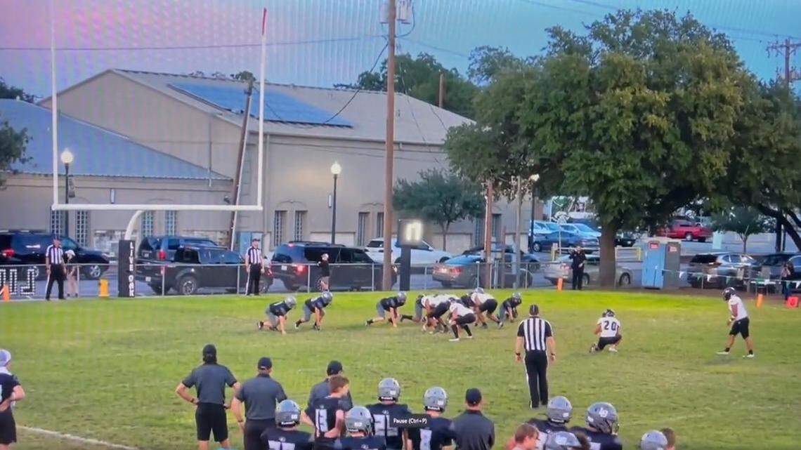 Prior to the football sticking the landing