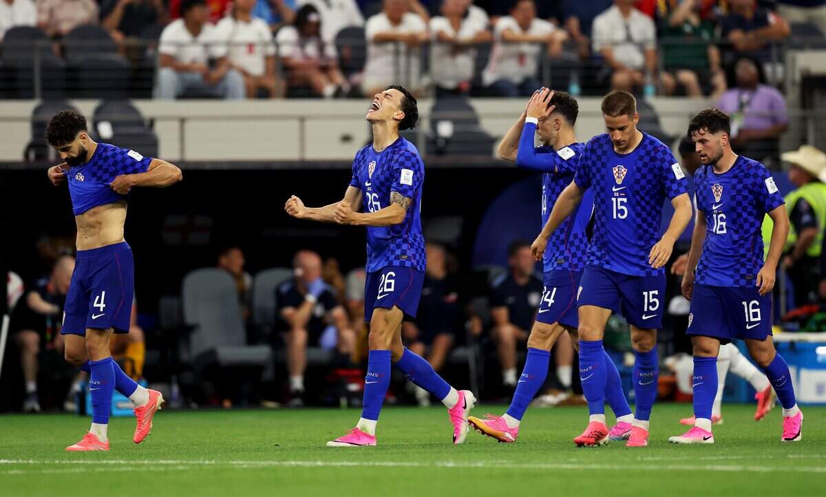 Croatia forward Petar Musa (26) celebrates a goal against England during the first half of the World Cup matchup against England on Wednesday, June 17, 2026, at Dallas Stadium in Arlington.