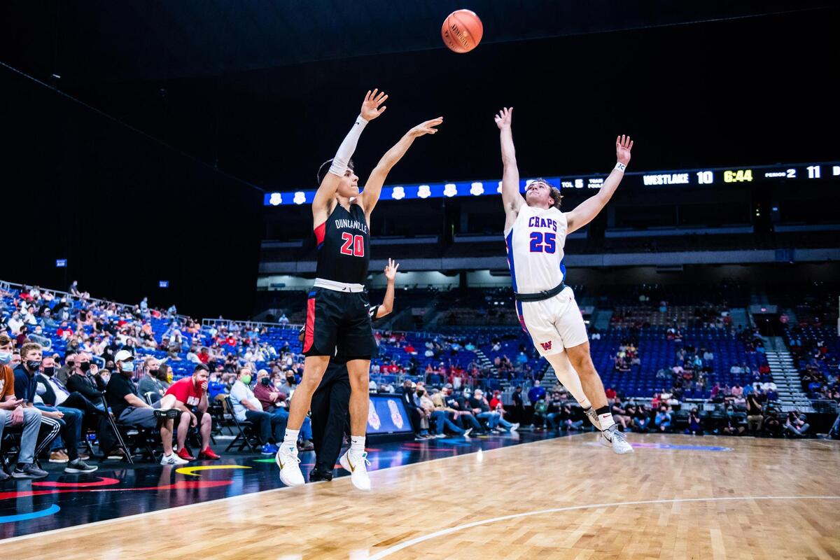 Juan Reyna (20) shoots a three during the 6A state final between Duncanville and Austin Westlake at the Alamodome in San Antonio Texas, on March 13, 2021. Duncanville went on to win 66-53. (Photo by Matt Smith. Special to the Star-Telegram).