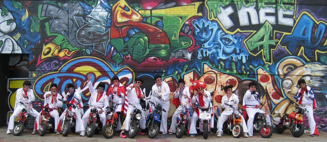 The motley crew of “The World Famous Wheelie-ing Elvi” pose for a photo.