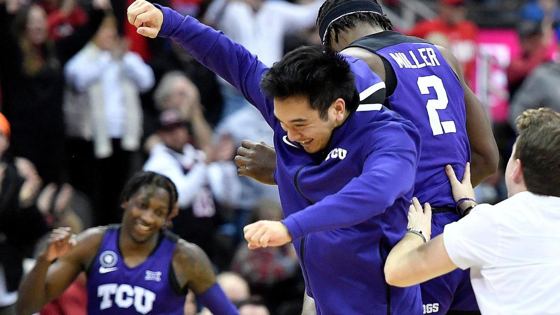 TCU’s Damion Baugh (10) and Emanuel Miller (2) celebrate the Horned Frogs 65-60 win over Texas Thursday at the Big 12 Tournament in Kansas City.