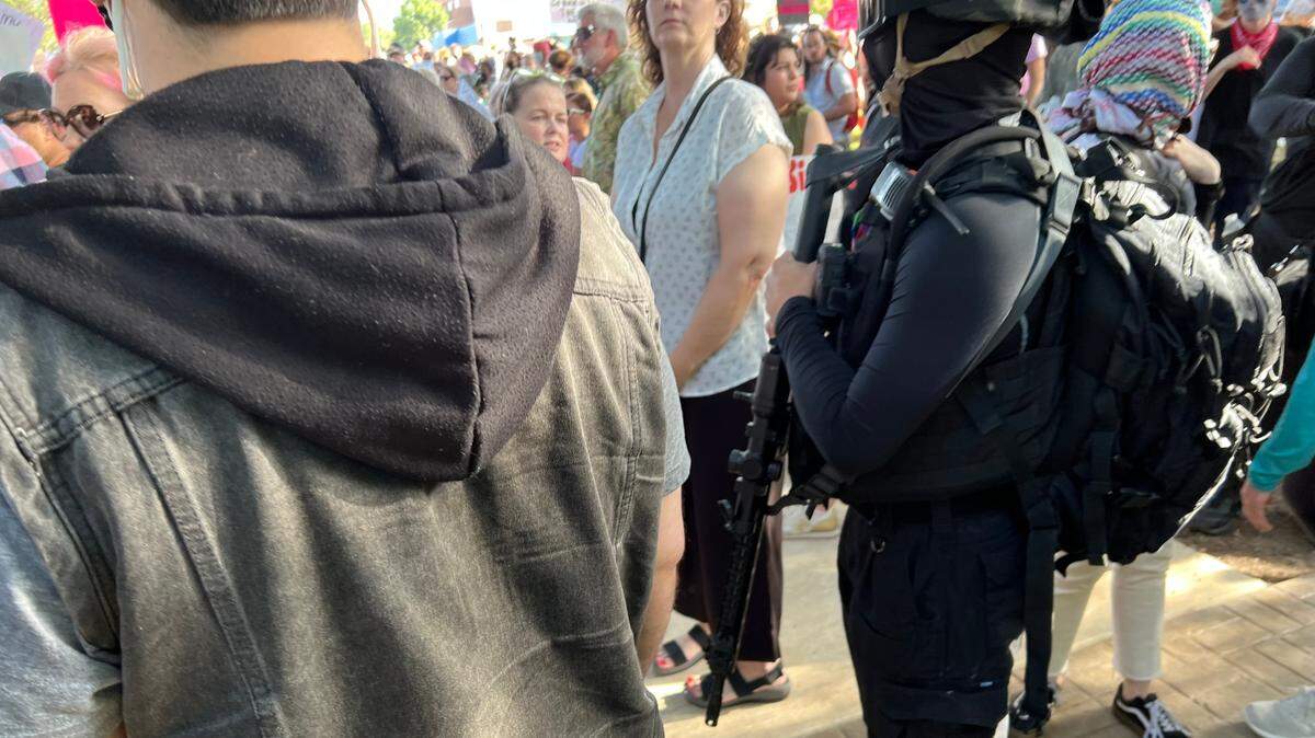 One armed counter-protester stands in the crowd during Tuesday’s abortion rights rally in front on Denton City Hall.
