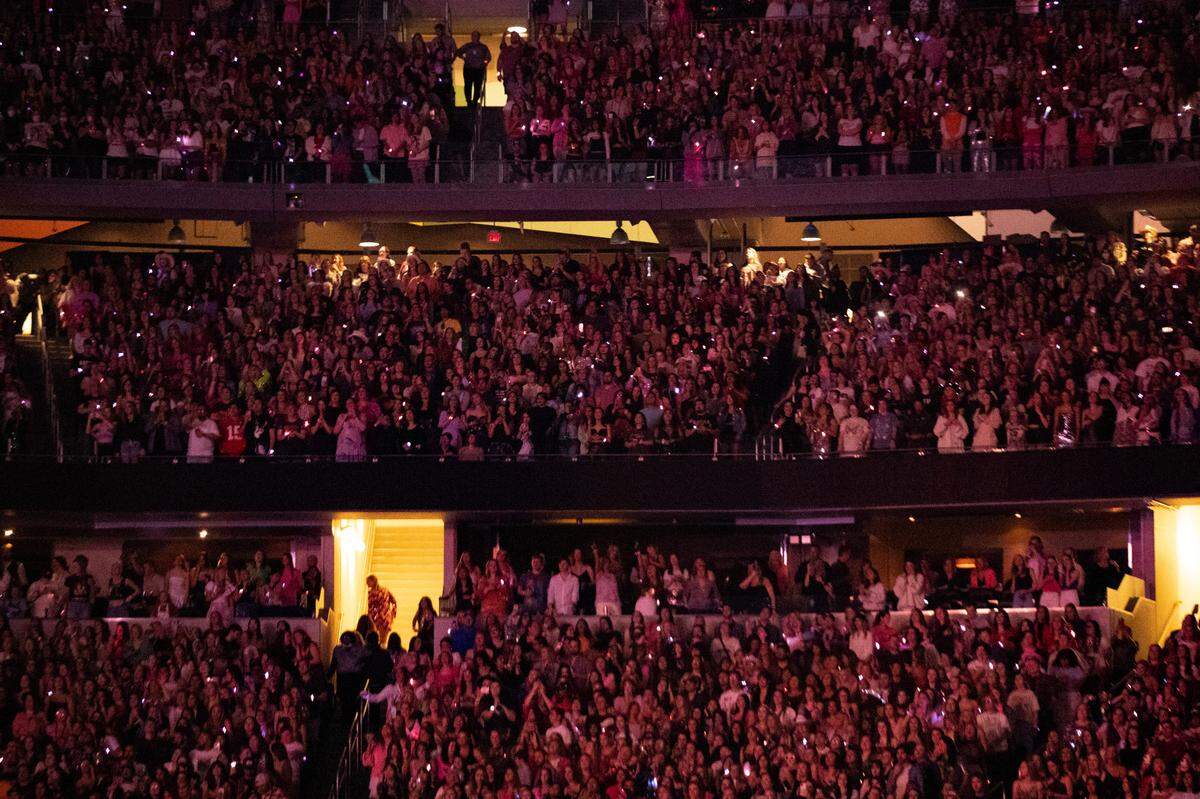Tens of thousands of fans pack AT&T Stadium to watch Taylor Swift during her first sold-out concert of three nights in Arlington on Friday, March 31, 2023.